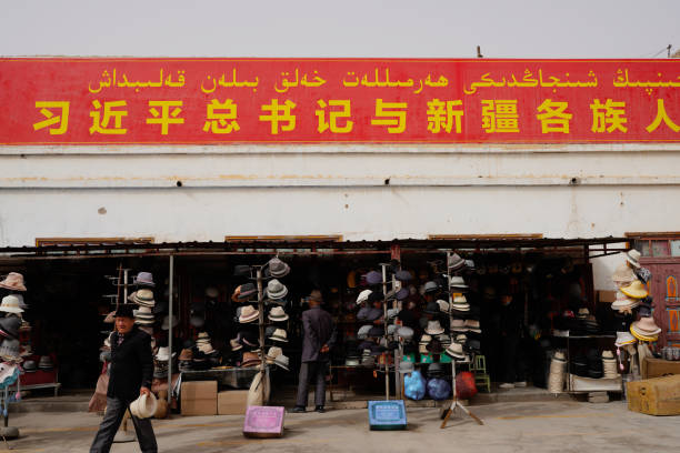 Kuqa，XINJIANG / China -April 21 2023:The commercial street in the old city of Kuqa, Xinjiang, where people buy daily necessities.