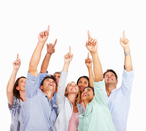 Excited business people pointing up
