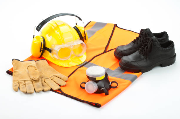 Personal safety workwear isolated on white background Personal Safety Workwear Isolated on White Background. Includes Hard Hat, Safety Glasses, Earmuff, Gloves, Steel Toe Shoes and Safety Vest.  See Related Photos on my Portfolio.http://i1215.photobucket.com/albums/cc503/carlosgawronski/SafetyWorkwear.jpg safety equipment stock pictures, royalty-free photos & images