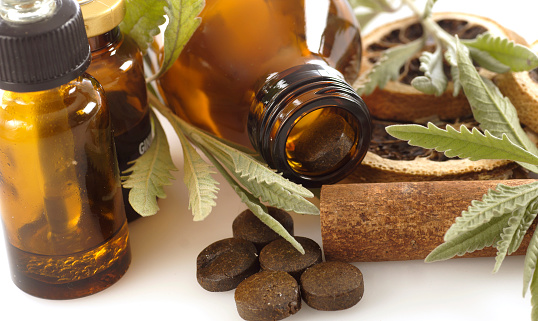 Pill bottles with licorice plants and Homeopathic  medicine