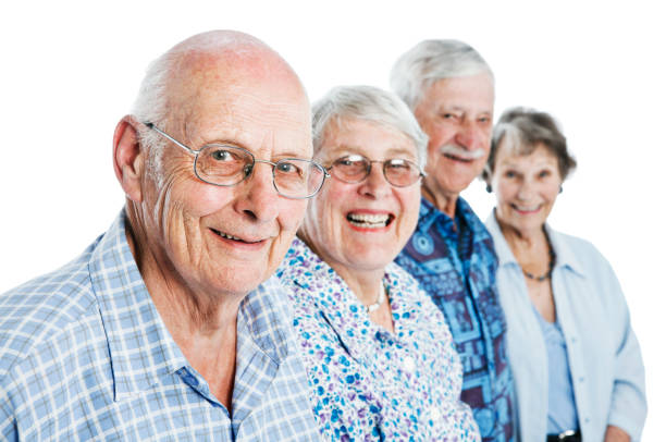 istock Four happy, positive senior citizens against white background 154945655