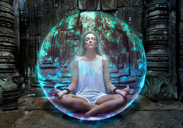 Young woman meditates inside protective bubble stock photo