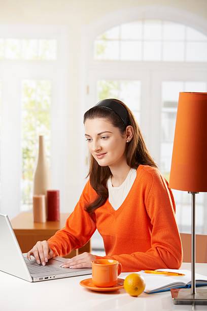 Student girl doing homework stock photo