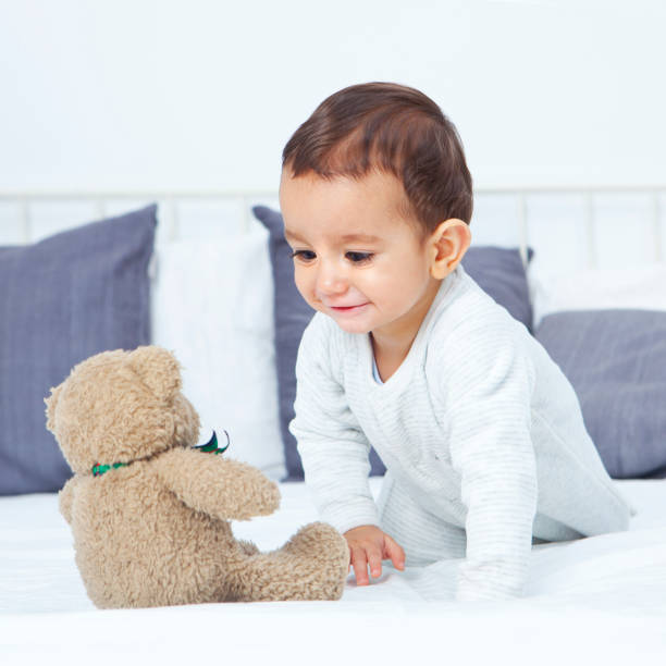 istock Playful baby on bed 154946246