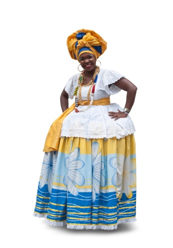 Woman wearing a typical costume from Bahia State in Brazil. Isolated. She is a typical Bahiana.