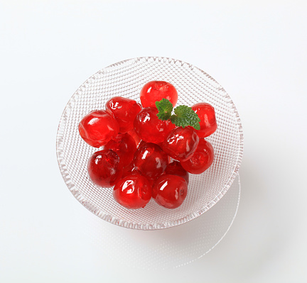 Cherry. Sweet Cherries in wooden box or crate on white stone concrete background. Ripe Sweet Red Cherries. Top view.