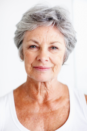 Closeup of beautiful senior woman on white background