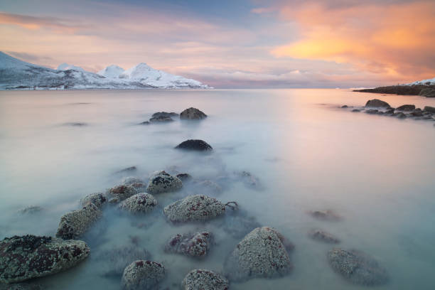 Arctic Seascape An arctic fjord runs out to sea near Tromsø in Arctic Norway sommaroy stock pictures, royalty-free photos & images