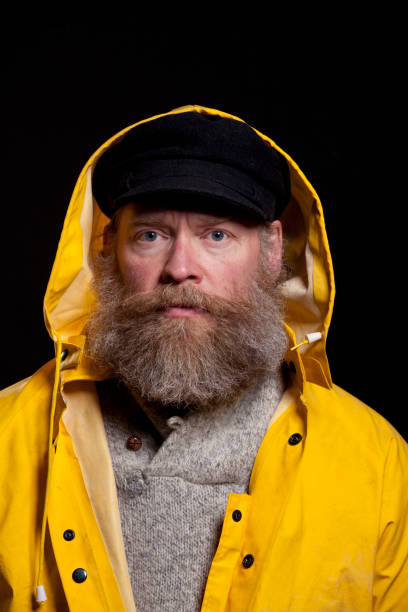 istock fisherman in a hood 154946991