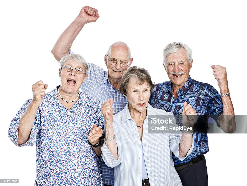 Four happy seniors cheering and waving clenched fists  Senior Adult Stock Photo