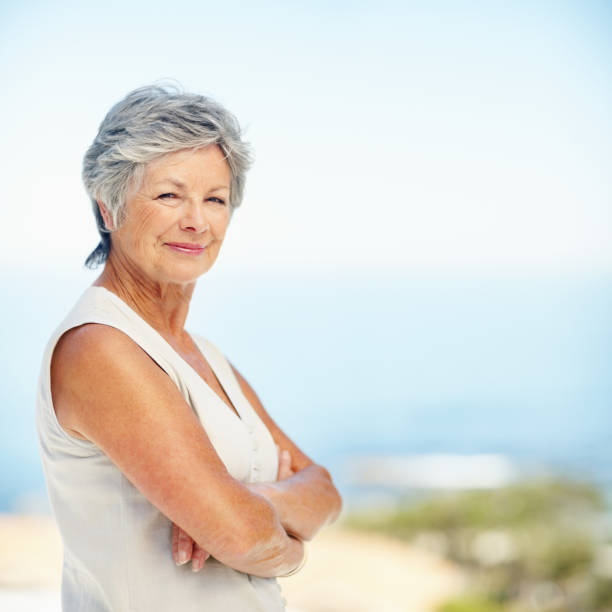 istock Attractive, elderly woman with arms folded 154947365