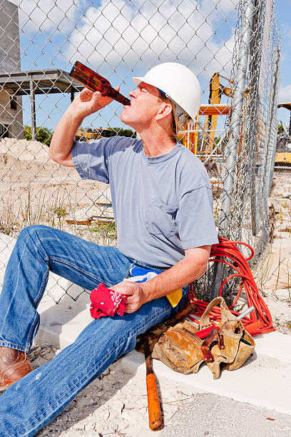 Drinking off the Job  superintendent stock pictures, royalty-free photos & images