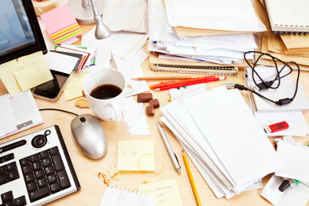 istock High angle view of messy desk 154947617