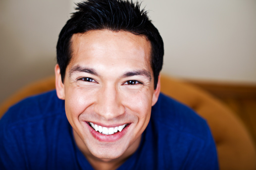 Closeup portrait of a smiling healthy young man