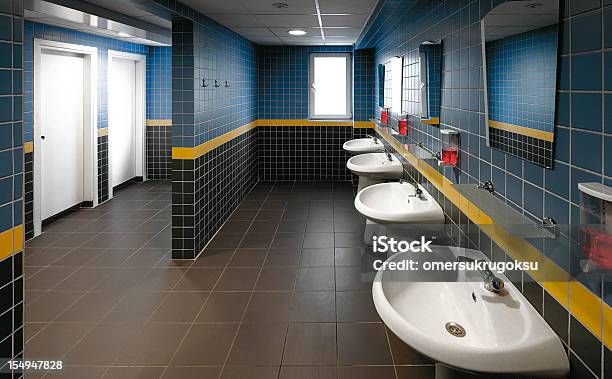 Commercial Bathroom Showing The Sinks Stock Photo - Download Image Now - Public Restroom, Soap Dispenser, No People