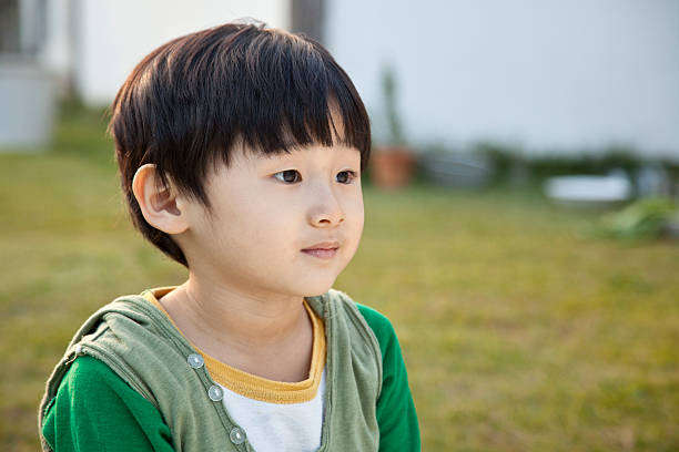 Little Japanese boy outdoors.  Istockalypse Tokyo, Japan.