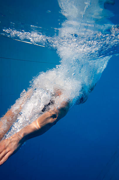 istock Young man dives into the pool 154948392