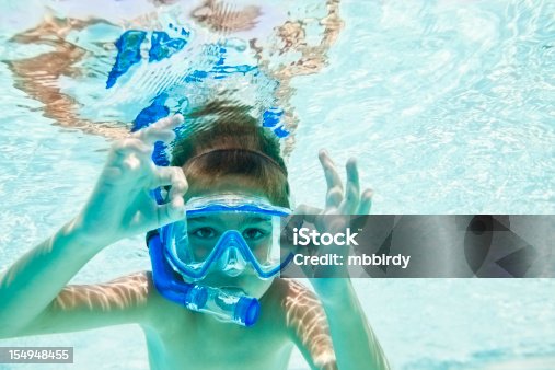 istock Child snorkeling in swimming pool 154948455