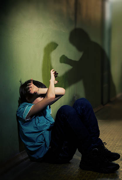 Child victim Child is protected from blow victim photos stock pictures, royalty-free photos & images