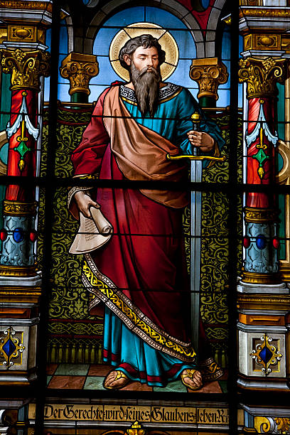 Saint with sword Beautiful stained glass window created by F. Zettler (1878-1911) at the German Church (St. Gertrude's church) in Gamla Stan in Stockholm.  stained glass photos stock pictures, royalty-free photos & images