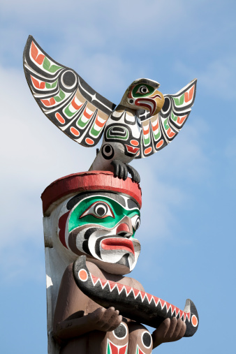 A totem bird over the blue sky,Stanley Park,Vancouver,British Columbia,Canada.