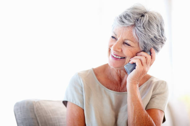 istock Elderly woman talking on phone 154948681