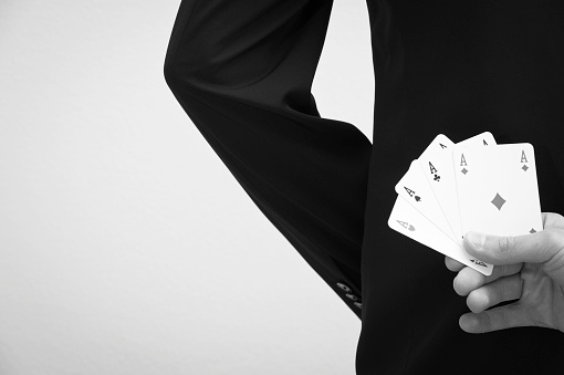 Elegance person hiding four aces in hand. 

View my lightbox:[url=http://www.istockphoto.com/search/lightbox/8961515?refnum=SimmiSimons#b56e6d5]
[img]http://www.simonebecchetti.com/iStock/BusinessMagazine.jpg[/img][/url]

View my lightbox: [url=/file_search.php?action=file&lightboxID=10119660]
[img]http://www.simonebecchetti.com/iStock/HandMagazine.jpg[/img][/url]

View my lightbox:[url=http://www.istockphoto.com/search/lightbox/8969825?refnum=SimmiSimons#1be4dfd9]
[img]http://www.simonebecchetti.com/iStock/BWMagazine.jpg[/img][/url]