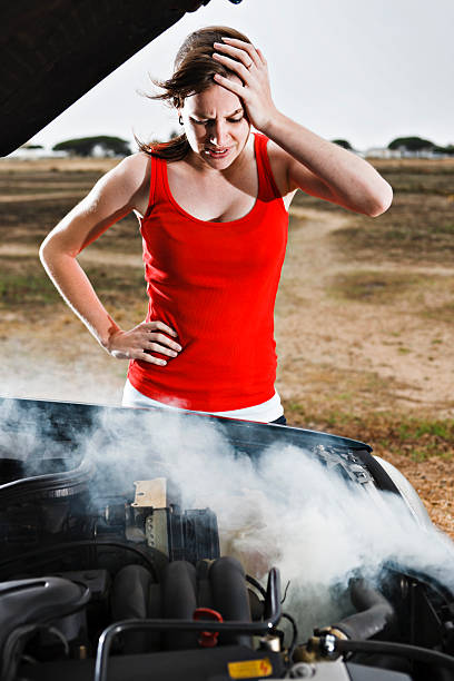 istock Pretty brunette desperate after car breakdown in a deserted area 154949020