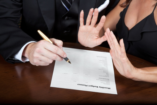 woman refusing to sign a monthly budget agreement 