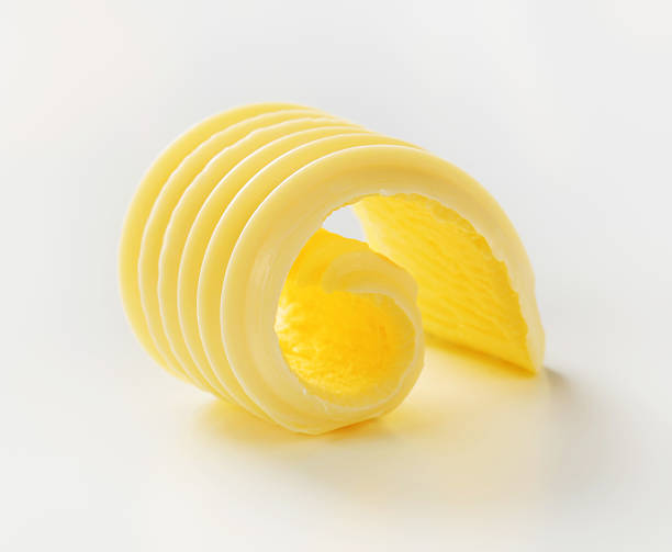 istock Close up slice of textured curled butter 154949149