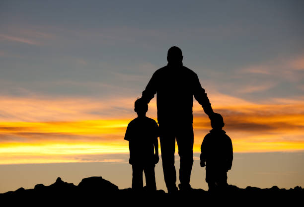 istock Silhouette of Father with Sons 154949213