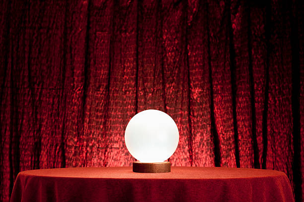 Fortune Teller's Crystal Ball. XXXL Glowing Crystal ball on a table - plenty of copy space area. fortune telling stock pictures, royalty-free photos & images