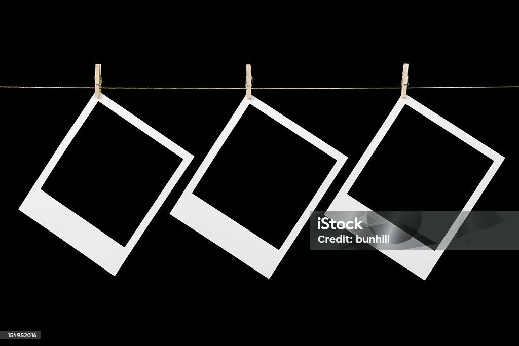 Três blanked de polaroid instantâneo de fotos penduradas - Foto de stock de Fotografia Instantânea royalty-free
