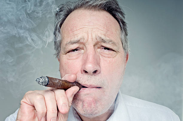 istock Businessman Smoking a Cigar 154952144