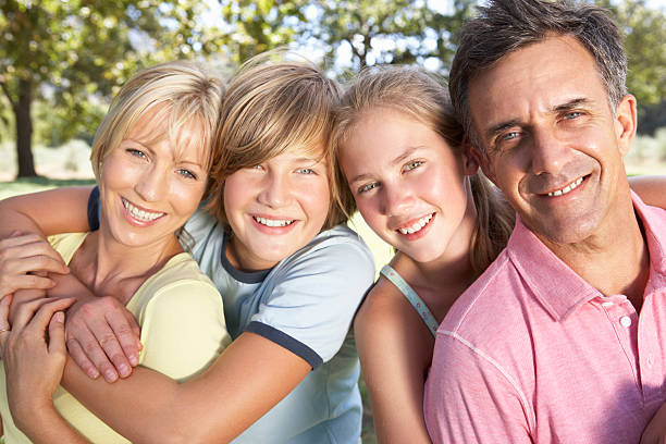 istock Middle Aged Family Relaxing In Countryside 154952156