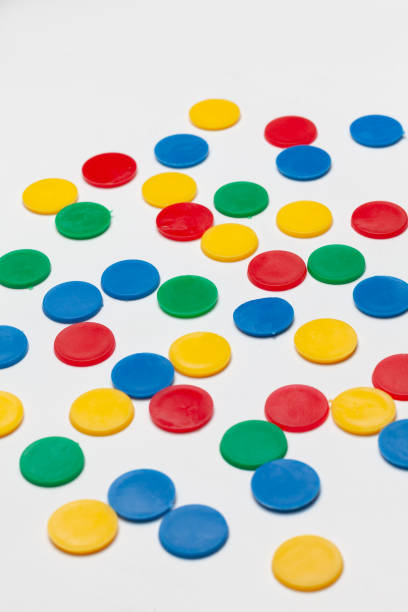 istock colorful plastic tokens isolated on white background 1549521767