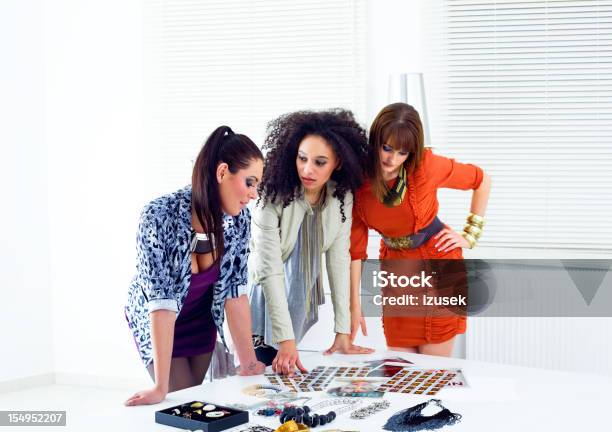 Discussing New Edition Stock Photo - Download Image Now - 20-29 Years, 30-39 Years, Adult