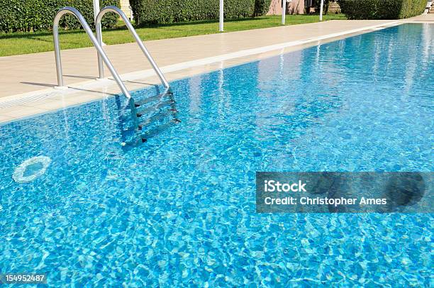 Beautiful Outdoor Hotel Swimming Pool In Sunshine Stock Photo - Download Image Now - Swimming Pool, Resort Swimming Pool, Ladder