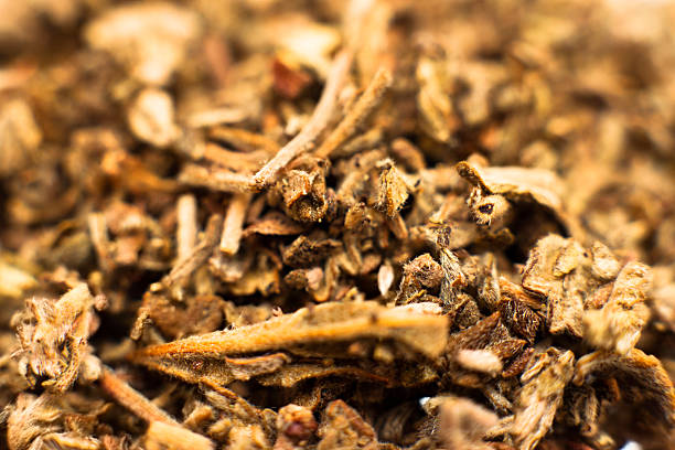 Close-up of a pre grounded spice Stock photo of a pile of spice.  This is a synthetic cannabinoid that is legal in some US states, illegal in others.  Commonly used by marijuana smokers as a replacement drug. cannabinoid stock pictures, royalty-free photos & images