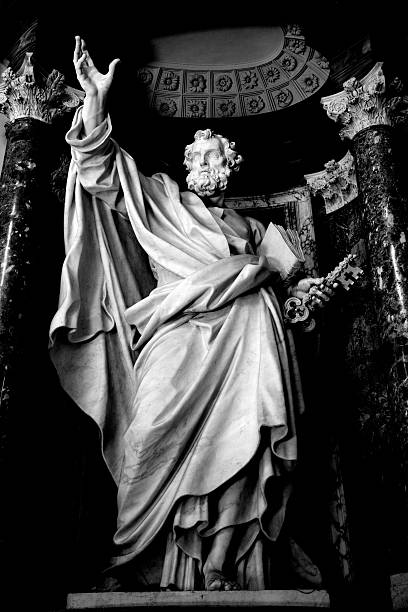 Saint Peter Apostle Series of the twelve Apostles. Statue of Saint Peter, one of the sculptures of the Twelve Apostles inside the Basilica of St. John Lateran. Rome, Italy. Sculpture by Pierre-Étienne Monnot (1657, Orchamps-Vennes - 1733, Roma), "San Pietro", 1708-13. Black and white, grained and vignetted image. http://www.massimomerlini.it/is/vatican.jpg http://www.massimomerlini.it/is/rome.jpg peter the apostle stock pictures, royalty-free photos & images