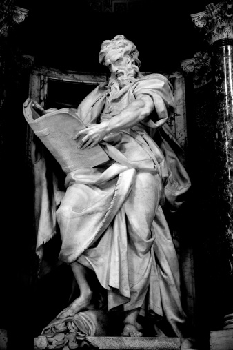 Series of the twelve Apostles. Statue of Saint Matthew, one of the sculptures of the Twelve Apostles inside the Basilica of St. John Lateran. Rome, Italy. Sculpture by Camillo Rusconi (1658, Milano - 1728, Roma),