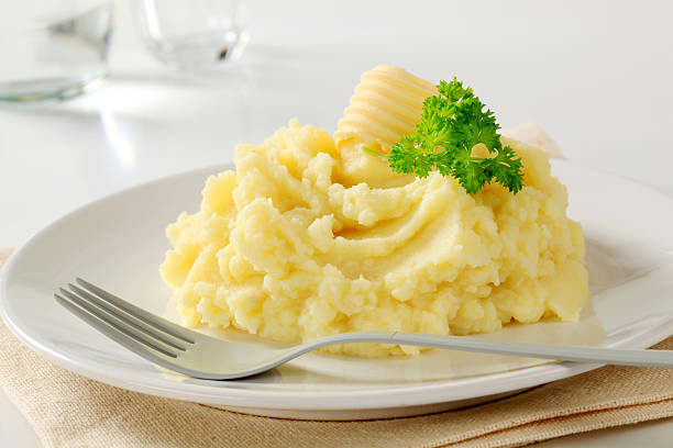 Close-up of mashed potatoes served on white ceramic plate Mashed potato Mashed Potatoes stock pictures, royalty-free photos & images