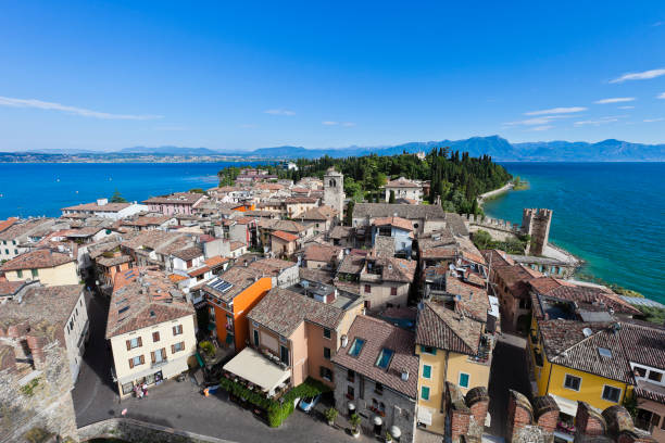 Sirmione stands on a peninsula that stretches out for about 4 km in the Lake Garda, surrounded by clear waters. It is the most visited and loved locality around the lake, appreciated for its climate and for the medieval borough with all the history enclosed by its walls. An example is the imposing thirteenth-century castle, the Rocca Scaligera, that dominates the town. 