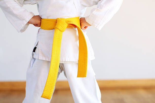 Karate uniform Karate uniform yellow belt stock pictures, royalty-free photos & images