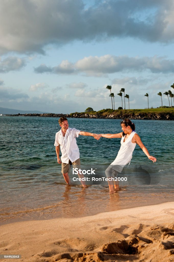 Playful Couple on Tropical Beach a tropical beach / contains a playful couple / playfully playing 30-39 Years Stock Photo