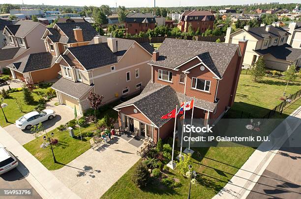 People Sitting In Front Of Their Brand New Home Stock Photo - Download Image Now - Car, Aerial View, Driveway