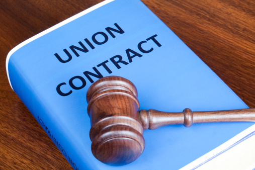 Judge's gavel on a Union contract book.
