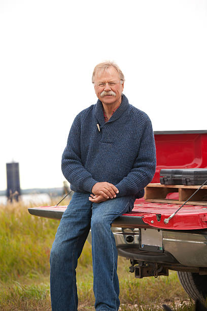 istock Cheerful Farmer With Truck on Farm 154954150