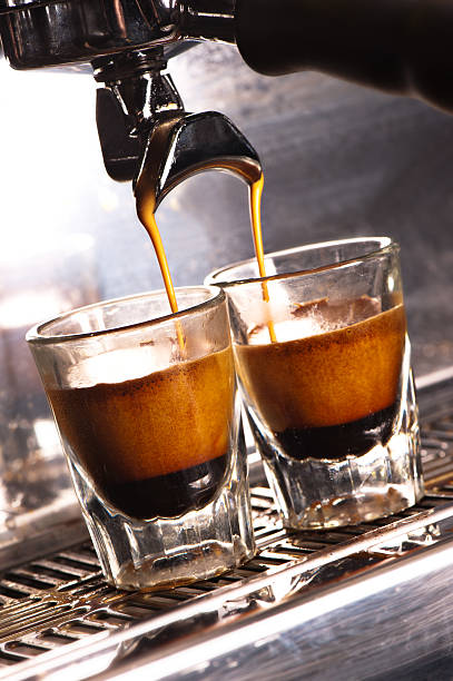 istock Cappuccino Machine pouring into two shot glasses. 154954151