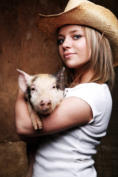 istock Woman and Pig 154954468